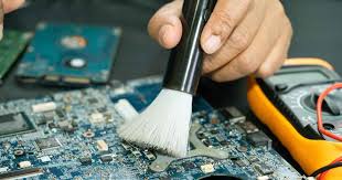 Technician soldering a component on a circuit board